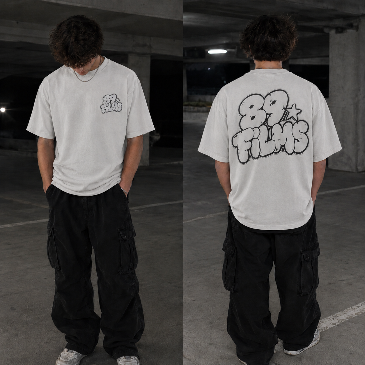 Model wearing the white oversized 89 FILMS tee, front and back, in a concrete parking garage at night